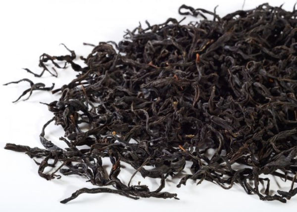 dark brown black tea leaves